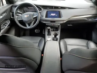 2023 Cadillac XT4 AWD Sport z VIN 1GYFZFR45PF128521, wystawiony jako Copart lot #53185325 z przebiegiem 17 657 mil mil oraz Szkoda całkowita • Salvage title. Historia ofert i sprzedaży dostępna na DreamBid. Obrazek 8.