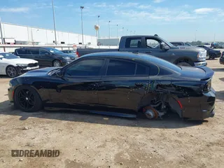 2019 Dodge Charger R/T with VIN 2C3CDXCT2KH575297, listed as a IAAI auction lot 41661339 with 119,854 mi miles and . Bid and sale history available at DreamBid. Image 14.