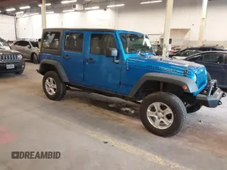 2015 Jeep Wrangler Unlimited Rubicon with VIN 1C4BJWFG7FL661643, listed as a IAAI auction lot 41291385 with 112,785 mi miles. Bid and sale history available at carsss.com. Image 1.