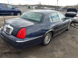 2001 Lincoln Town Car Signature with VIN 1LNHM82W61Y733577, listed as a IAAI auction lot 41899175 with 105,083 mi miles and . Bid and sale history available at DreamBid. Image 4.