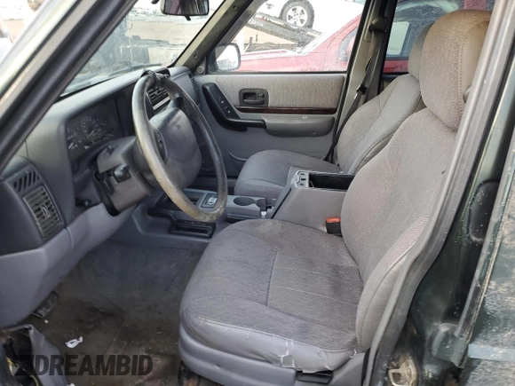 1997 Jeep Cherokee Country with VIN 1J4FJ78SXVL566804, listed as a Copart auction lot 88557395 with 216,230 mi miles and Salvage title. Bid and sale history available at DreamBid. Image 7.