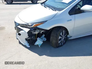 2021 Toyota Prius LE with VIN JTDKAMFP8M3174629, listed as a IAAI auction lot 42087974 with 16,348 mi miles and . Bid and sale history available at DreamBid. Image 6.