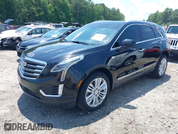 2018 Cadillac XT5 Premium Luxury AWD z VIN 1GYKNFRS3JZ112459, wystawiony jako IAAI lot #42590258 z przebiegiem 157 377 mil mil oraz . Historia ofert i sprzedaży dostępna na DreamBid. Obrazek 17.