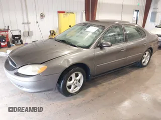 2003 Ford Taurus SE Standard z VIN 1FAFP53UX3G167579, wystawiony jako IAAI lot #42140606 z przebiegiem 178 147 mil mil oraz . Historia ofert i sprzedaży dostępna na DreamBid. Obrazek 2.
