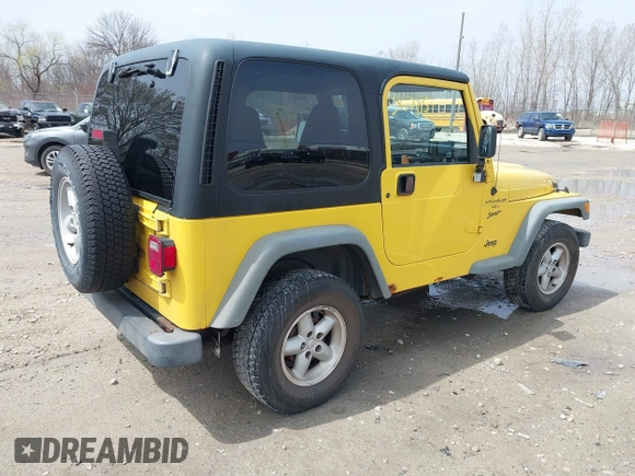 2000 Jeep Wrangler Sport with VIN 1J4FA49S2YP768451, listed as a IAAI auction lot 42136785 with 74,492 mi miles. Bid and sale history available at carsss.com. Image 4.