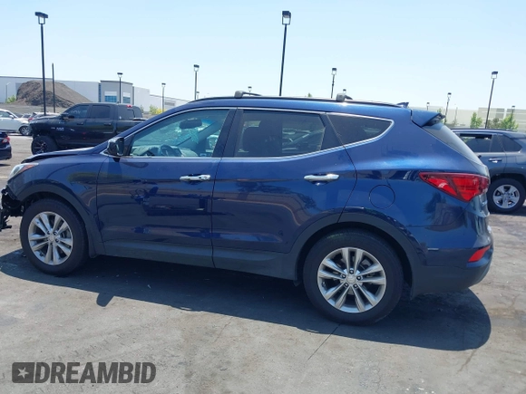 2018 Hyundai Santa Fe 2.0T z VIN 5XYZU4LA8JG537427, wystawiony jako IAAI lot #42349692 z przebiegiem 148 764 mil mil oraz . Historia ofert i sprzedaży dostępna na DreamBid. Obrazek 14.