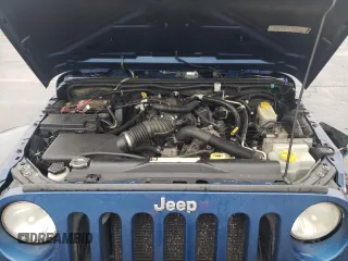 2009 Jeep Wrangler X with VIN 1J4FA24109L712701, listed as a Copart auction lot 60800855 with 156,709 mi miles and Salvage title. Bid and sale history available at DreamBid. Image 11.