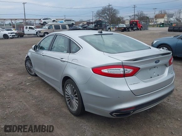 2016 Ford Fusion Titanium with VIN 3FA6P0K93GR117587, listed as a IAAI auction lot 42079701 with 142,105 mi miles. Bid and sale history available at carsss.com. Image 3.