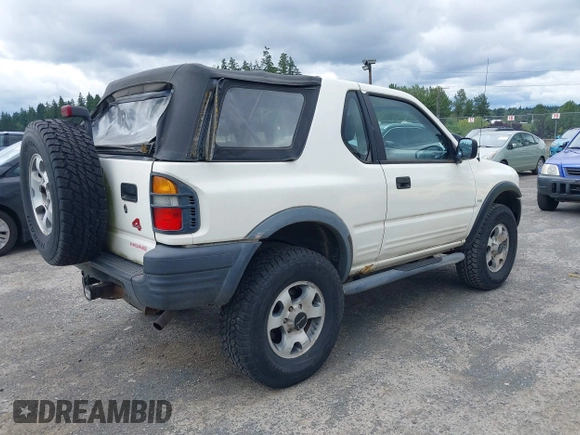 1998 Isuzu Rodeo with VIN 4S2CM57W9W4373049, listed as a IAAI auction lot 42599157 with 140,368 mi miles and . Bid and sale history available at DreamBid. Image 4.