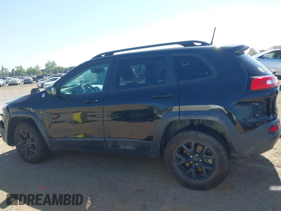 2016 Jeep Cherokee Trailhawk with VIN 1C4PJMBB9GW179051, listed as a IAAI auction lot 42520342 with 100,538 mi miles and . Bid and sale history available at DreamBid. Image 14.