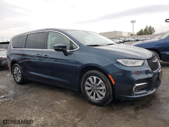 2023 Chrysler Pacifica Hybrid Touring L with VIN 2C4RC1L72PR632382, listed as a Copart auction lot 50989035 with 44,061 mi miles and Salvage Title. Bid and sale history available at carsss.com. Image 4.