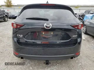 2020 Mazda CX-5 Touring with VIN JM3KFBCM1L0792706, listed as a Copart auction lot 73032144 with 56,845 mi miles and Salvage Title. Bid and sale history available at carsss.com. Image 6.
