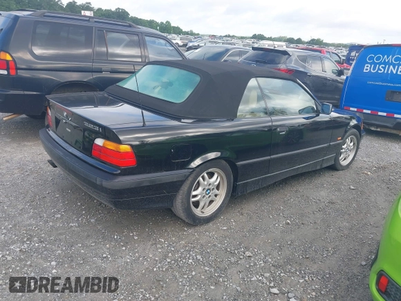 1999 BMW 3 Series 323i with VIN WBABJ8330XEM23911, listed as a IAAI auction lot 42523948 with 125,371 mi miles and . Bid and sale history available at DreamBid. Image 4.