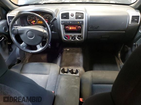 2009 GMC Canyon Work Truck z VIN 1GTDT19E798132510, wystawiony jako Copart lot #57361995 z przebiegiem 240 338 mil mil oraz Czysty tytuł • Clean title. Historia ofert i sprzedaży dostępna na DreamBid. Obrazek 8.