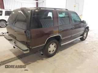 1996 Chevrolet Tahoe z VIN 1GNEK13R3TJ387858, wystawiony jako IAAI lot #41675147 z przebiegiem 196 811 mil mil oraz . Historia ofert i sprzedaży dostępna na DreamBid. Obrazek 4.