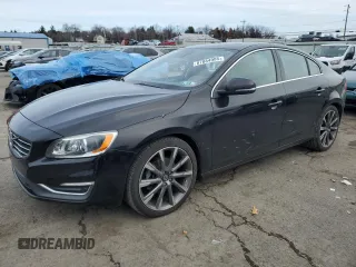 2015 Volvo S60 T5 Drive-E Platinum with VIN YV140MFMXF1351806, listed as a Copart auction lot 87884985 with 43,230 mi miles and Salvage Title. Bid and sale history available at carsss.com. Image 1.