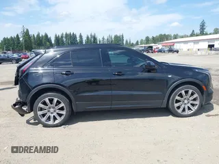 2019 Cadillac XT4 AWD Sport z VIN 1GYFZFR48KF119062, wystawiony jako IAAI lot #42449132 z przebiegiem 89 676 mil mil oraz . Historia ofert i sprzedaży dostępna na DreamBid. Obrazek 13.