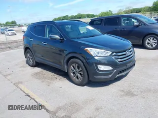 2014 Hyundai Santa Fe with VIN 5XYZUDLB0EG187984, listed as a IAAI auction lot 42607599 with 111,594 mi miles and . Bid and sale history available at DreamBid. Image 1.