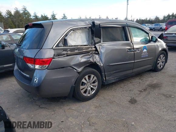 2014 Honda Odyssey EX-L with VIN 5FNRL5H67EB073640, listed as a IAAI auction lot 41115124 with 99,841 mi miles and . Bid and sale history available at carsss.com. Image 4.