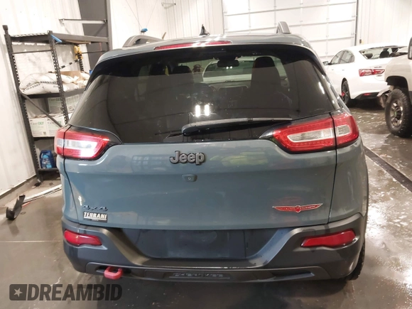 2015 Jeep Cherokee Trailhawk with VIN 1C4PJMBB4FW528633, listed as a IAAI auction lot 42147632 with 166,669 mi miles and . Bid and sale history available at DreamBid. Image 16.
