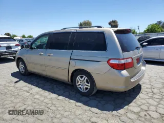 2005 Honda Odyssey EX-L with VIN 5FNRL38625B045152, listed as a Copart auction lot 57633005 with 145,776 mi miles and Salvage title. Bid and sale history available at DreamBid. Image 2.
