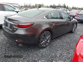 2018 Mazda 6 Grand Touring with VIN JM1GL1TYXJ1301545, listed as a IAAI auction lot 41131114 with 34,089 mi miles and . Bid and sale history available at DreamBid. Image 4.