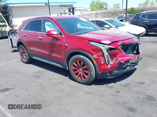 2019 Cadillac XT4 FWD Premium Luxury z VIN 1GYFZCR40KF136453, wystawiony jako IAAI lot #42302889 z przebiegiem 52 223 mil mil oraz . Historia ofert i sprzedaży dostępna na DreamBid. Obrazek 1.