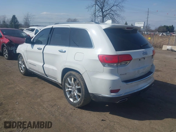 2015 Jeep Grand Cherokee Summit with VIN 1C4RJFJGXFC734025, listed as a IAAI auction lot 41842927 with 137,993 mi miles. Bid and sale history available at carsss.com. Image 3.