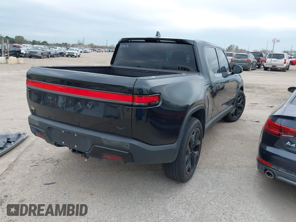 2023 Rivian R1T Adventure with VIN 7FCTGAAA2PN023485, listed as a IAAI auction lot 41227330 with 1 mi miles. Bid and sale history available at carsss.com. Image 4.