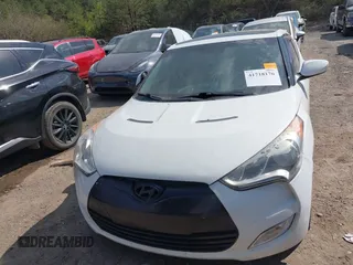 2014 Hyundai Veloster with VIN KMHTC6AD1EU217707, listed as a IAAI auction lot 41718176 with 191,306 mi miles. Bid and sale history available at carsss.com. Image 6.