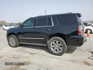 2015 GMC Yukon Denali with VIN 1GKS2CKJ2FR580533, listed as a Copart auction lot 48455205 with 147,532 mi miles and Salvage Title. Bid and sale history available at carsss.com. Image 2.