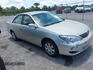 2002 Toyota Camry LE z VIN JTDBE32K520113147, wystawiony jako IAAI lot #42350611 z przebiegiem 265 485 mil mil oraz . Historia ofert i sprzedaży dostępna na DreamBid. Obrazek 1.