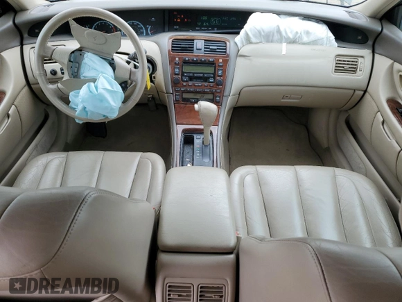 2000 Toyota Avalon XL with VIN 4T1BF28B4YU105732, listed as a Copart auction lot 54752665 with 143,855 mi miles and Salvage Title. Bid and sale history available at DreamBid. Image 8.