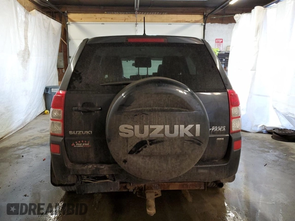 2011 Suzuki Grand Vitara Premium z VIN JS3TD0D24B4103142, wystawiony jako Copart lot #43715135 z przebiegiem 170 422 mil mil oraz Szkoda całkowita • Salvage title. Historia ofert i sprzedaży dostępna na DreamBid. Obrazek 6.