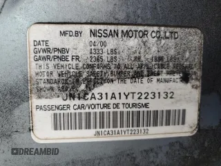 2000 Nissan Maxima GXE with VIN JN1CA31A1YT223132, listed as a Copart auction lot 60148655 with 269,258 mi miles and Salvage title. Bid and sale history available at DreamBid. Image 12.