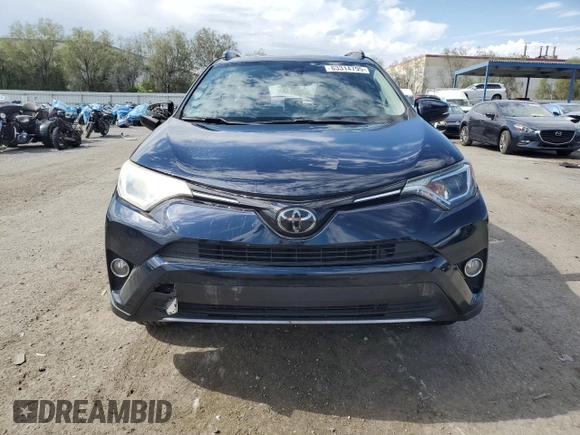 2018 Toyota RAV4 XLE with VIN JTMWFREV7JD130465, listed as a Copart auction lot 63314795 with 97,334 mi miles and Salvage title. Bid and sale history available at DreamBid. Image 5.