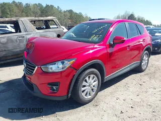 2016 Mazda CX-5 Touring with VIN JM3KE4CY0G0890309, listed as a IAAI auction lot 41890840 with 89,023 mi miles and . Bid and sale history available at carsss.com. Image 2.