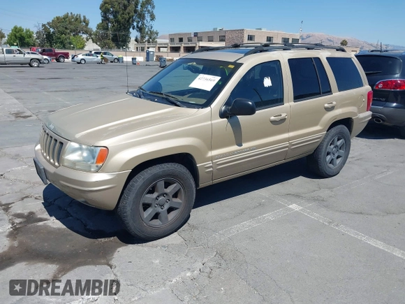 2000 Jeep Grand Cherokee Laredo z VIN 1J4G258S5YC237373, wystawiony jako IAAI lot #42736569 z przebiegiem 103 310 mil mil oraz . Historia ofert i sprzedaży dostępna na DreamBid. Obrazek 2.