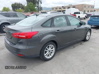 2015 Ford Focus SE with VIN 1FADP3F29FL342311, listed as a IAAI auction lot 42109683 with 70,579 mi miles. Bid and sale history available at carsss.com. Image 4.