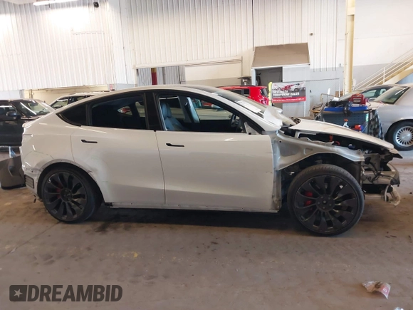 2021 Tesla Model Y Performance with VIN 5YJYGDEF4MF263473, listed as a IAAI auction lot 41851083 with 39,289 mi miles and . Bid and sale history available at DreamBid. Image 14.