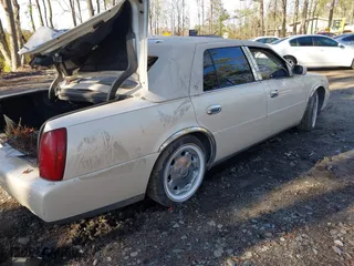 2002 Cadillac DeVille DHS with VIN 1G6KE57Y42U216449, listed as a IAAI auction lot 41611917 with 73,054 mi miles. Bid and sale history available at carsss.com. Image 4.