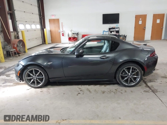 2021 Mazda MX-5 Miata Grand Touring with VIN JM1NDAM73M0451484, listed as a IAAI auction lot 41485044 with 11,328 mi miles and . Bid and sale history available at DreamBid. Image 14.