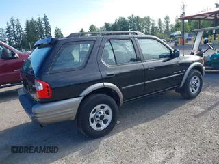 2001 Isuzu Rodeo S z VIN 4S2CK58W914361058, wystawiony jako IAAI lot #42404904 z przebiegiem 125 945 mil mil oraz . Historia ofert i sprzedaży dostępna na DreamBid. Obrazek 4.