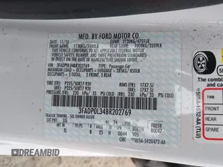 2011 Ford Fusion Hybrid z VIN 3FADP0L34BR202769, wystawiony jako IAAI lot #42504494 z przebiegiem 33 902 mil mil oraz . Historia ofert i sprzedaży dostępna na DreamBid. Obrazek 9.