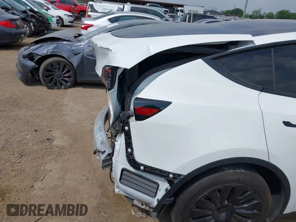 2023 Tesla Model Y Long Range with VIN 7SAYGAEEXPF776370, listed as a IAAI auction lot 42127512 with 27,120 mi miles and . Bid and sale history available at DreamBid. Image 23.