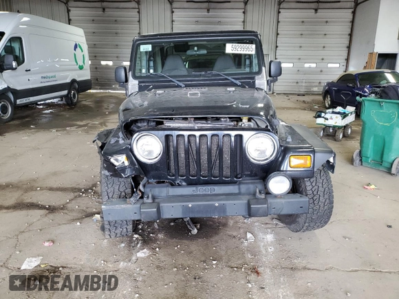 2002 Jeep Wrangler Sport with VIN 1J4FA49S62P713475, listed as a Copart auction lot 59299965 with 114,654 mi miles and Non repairable. Bid and sale history available at DreamBid. Image 5.