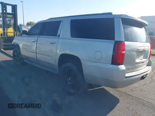 2015 Chevrolet Suburban LT z VIN 1GNSCJKC1FR608117, wystawiony jako IAAI lot #41641560 z przebiegiem 163 770 mil mil oraz . Historia ofert i sprzedaży dostępna na DreamBid. Obrazek 3.