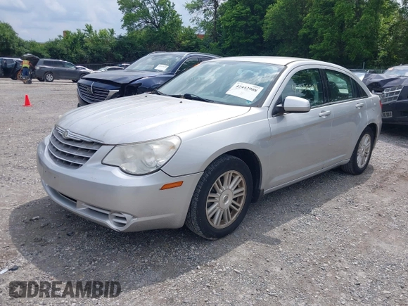 2009 Chrysler Sebring Touring z VIN 1C3LC56BX9N505929, wystawiony jako IAAI lot #42442908 z przebiegiem 114 012 mil mil oraz . Historia ofert i sprzedaży dostępna na DreamBid. Obrazek 2.