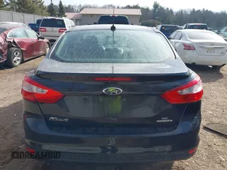 2013 Ford Focus SE z VIN 1FADP3F28DL312357, wystawiony jako IAAI lot #41798311 z przebiegiem 98 280 mil mil oraz . Historia ofert i sprzedaży dostępna na DreamBid. Obrazek 16.