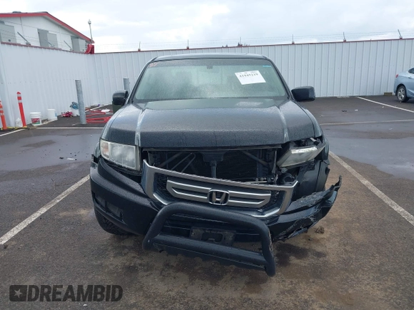 2011 Honda Ridgeline RTL with VIN 5FPYK1F53BB001385, listed as a IAAI auction lot 41945219 with 168,713 mi miles and . Bid and sale history available at DreamBid. Image 12.